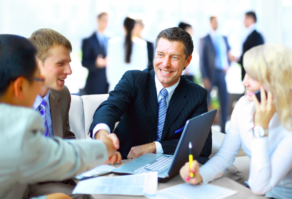 man shaking hands representing insurance bonds